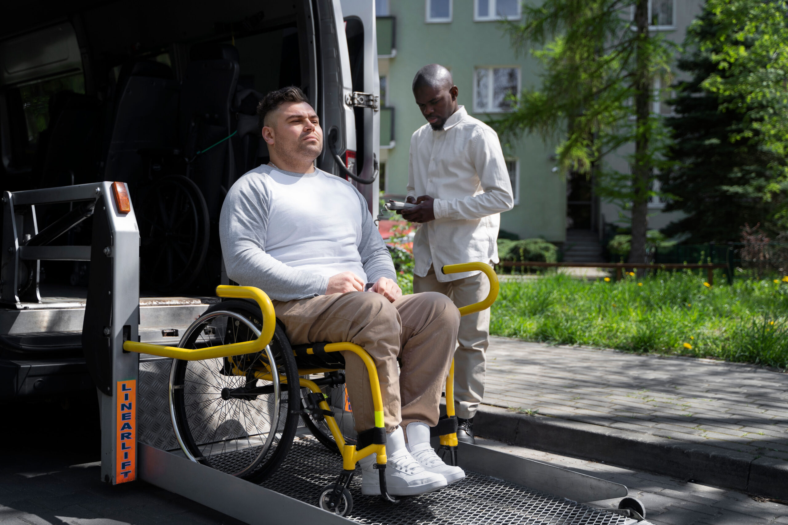 A man who uses a wheelchair, pictured full length